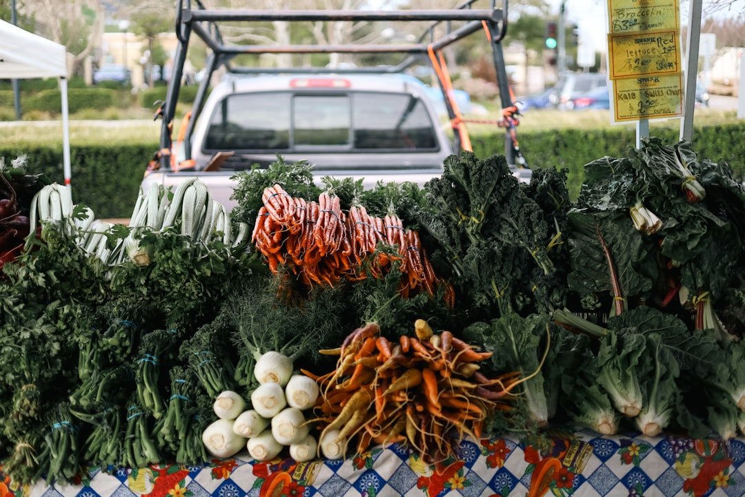 Shopper at California farmers market talking with farmer while selecting imperfect but delicious looking produce